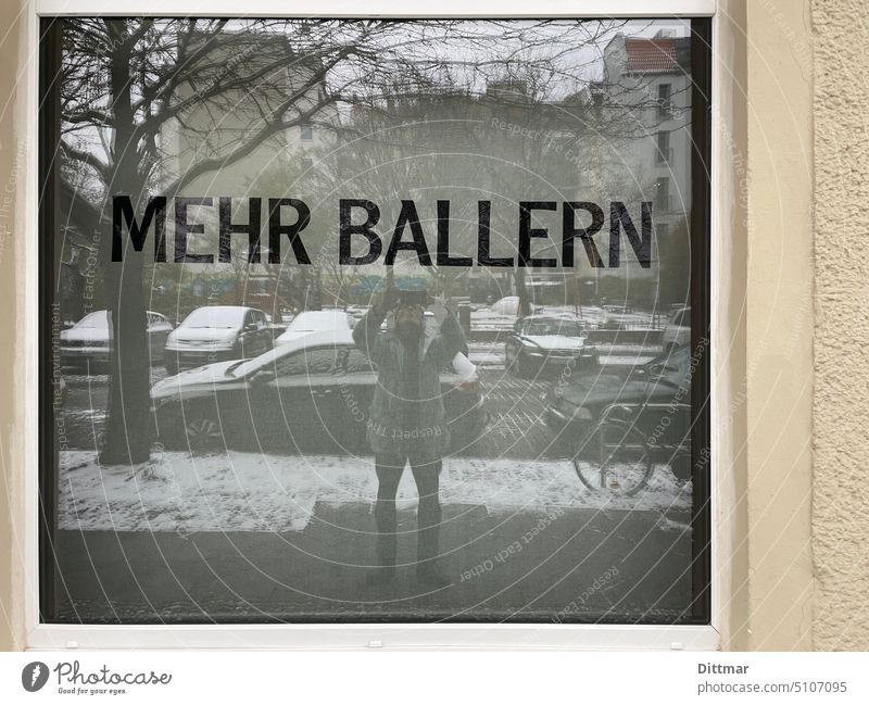 man photographs shop window Shop window reflection Self portrait Winter Advertising more bang