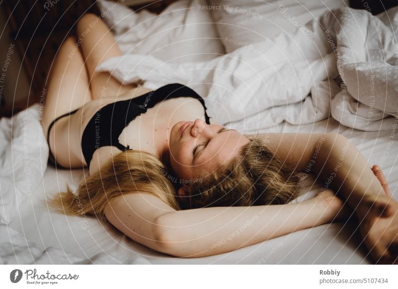 blonde young woman lies in bed with underwear portrait Bedroom Dressing room Attractive pretty Model move out Blonde Woman youthful fashion Underwear Bra Lie