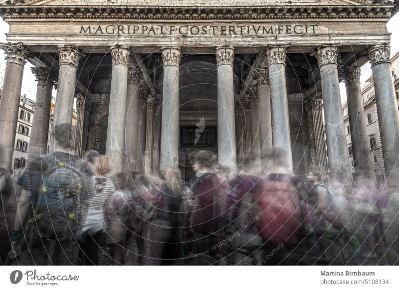 Many moving tourists in front of the Pantheon, Rome rome pantheon classicism entrance temple blue stone architecture italy portico columns ancient piazza roman