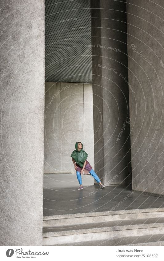 Some fine brutalism architecture and a dancing girl around these concrete walls in Vilnius, Lithuania. Her colorful clothes make a fine contrast between these grey walls.