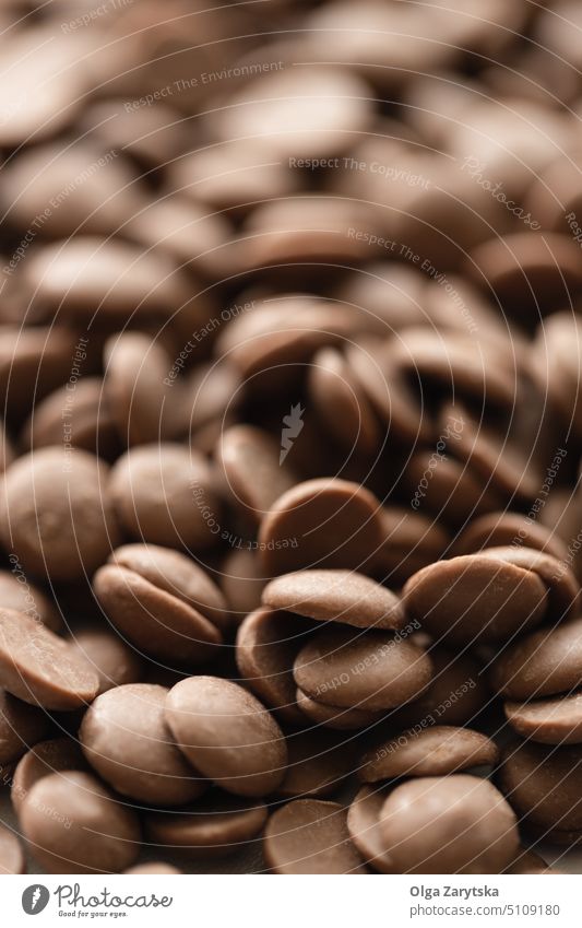 Milk chocolate chips. milk drop cocoa ingredient sweet confection product sugar food close-up selective focus pastry