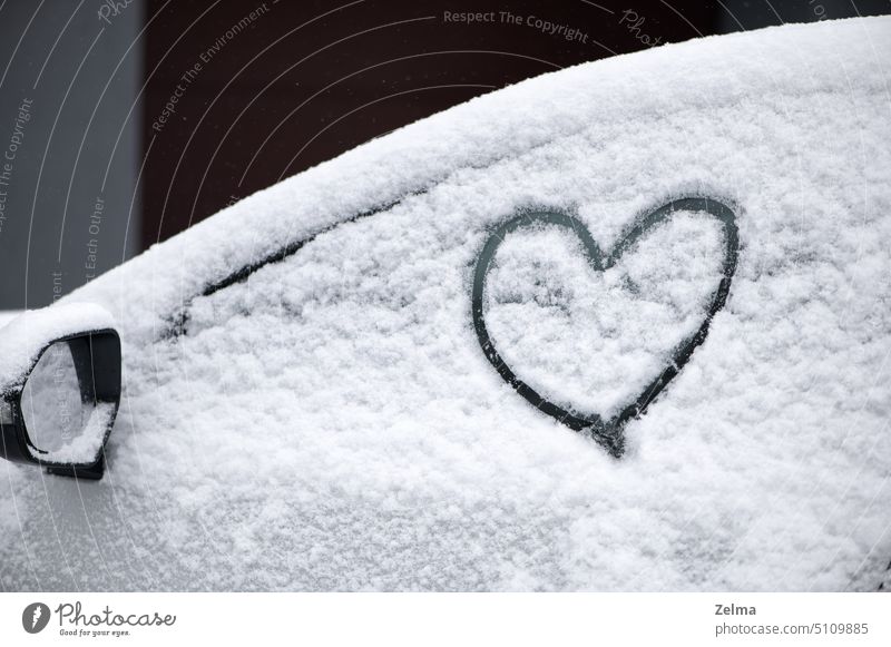 Lovely heart symbol drawn by hand on snowy car window at day light. Christmas and New Year concept abstract background beautiful beauty celebration christmas