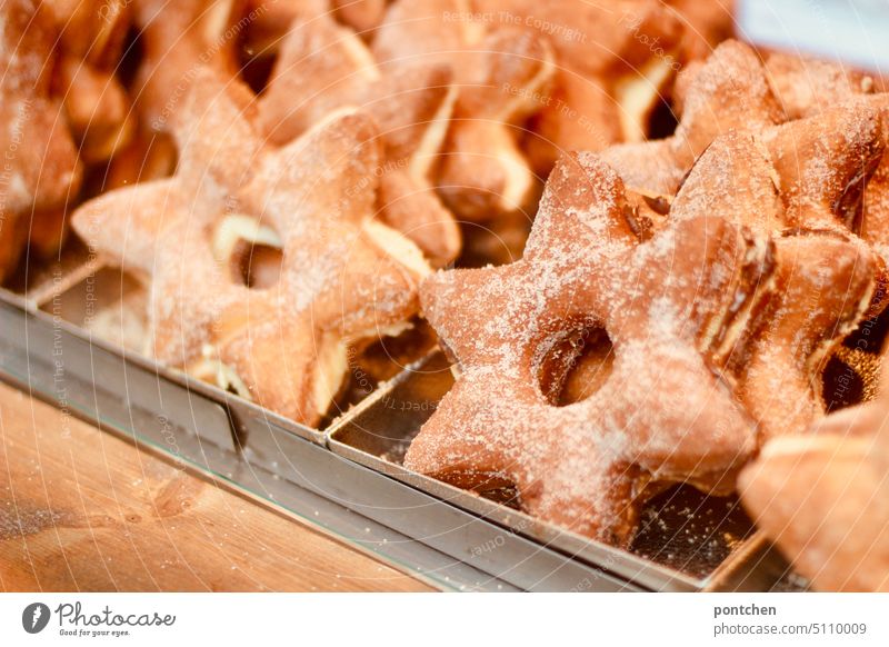 cinnamon stars at the christmas market. sales booth Cinnamon Stars Christmas Fair Sell candy calories biscuits Tradition Feasts & Celebrations