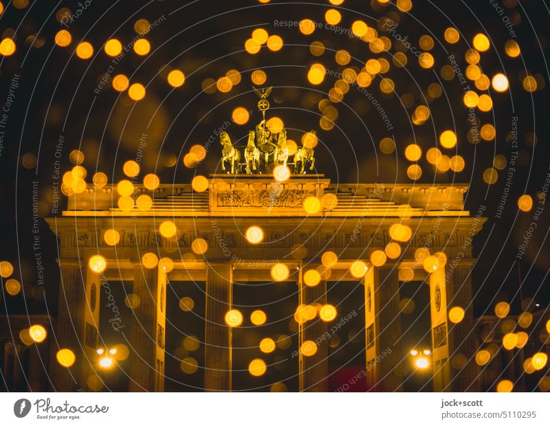 Brandenburg Gate shiny and sparkling Christmas mood Christmas fairy lights Glittering defocused blurriness Illuminate Fairy lights sparkle Abstract holy night