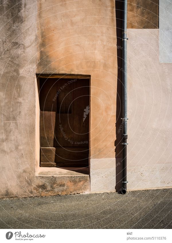 Door and shadow on a house in Roussillon, Provence door Shadow Wall (building) house wall Colour photo Facade Exterior shot Deserted Day Town Building