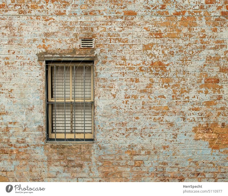 Brick facade with barred window Brick wall Wall (barrier) Exterior shot Facade Old Structures and shapes Red Deserted Pattern Detail Chaos individual peculiar