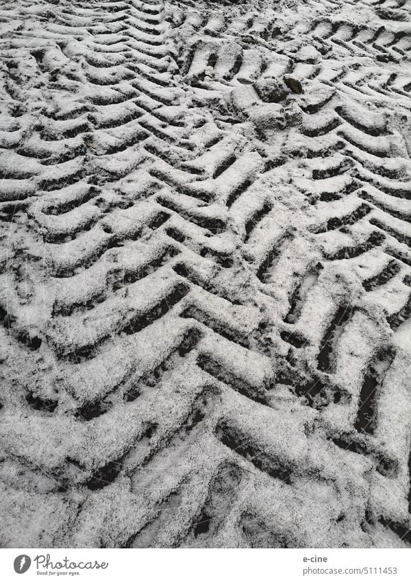Tire tracks in the snow due to field work with a tractor Field Working in the fields Skid marks Tractor Tractor track Winter Pattern Agriculture Exterior shot