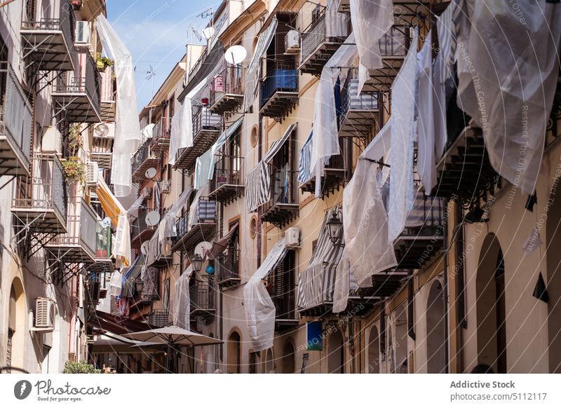 Narrow street between residential buildings in Palermo house architecture narrow exterior balcony facade palermo sicily italy old construction colorful district