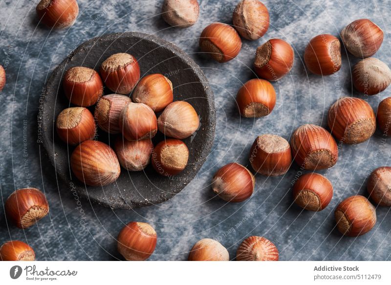 Fresh hazelnuts on marble table plate shell fresh organic ripe ingredient vitamin bunch tasty fruit natural raw diet product healthy food bowl kitchen
