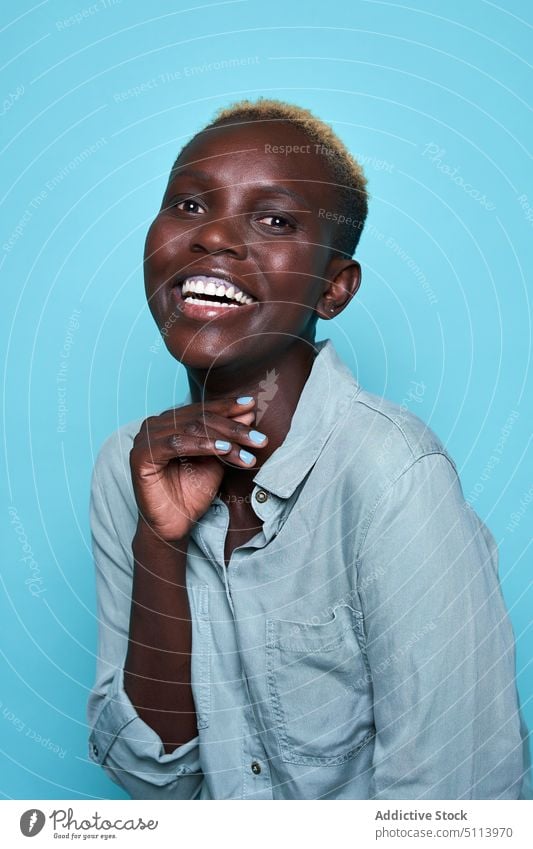 Young African American woman laughing joke style smile happy model tilt appearance color portrait bright female black african american ethnic young short hair