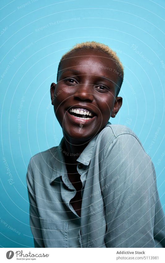 Young African American woman laughing style smile happy model tilt appearance color portrait bright female black african american ethnic young short hair blond