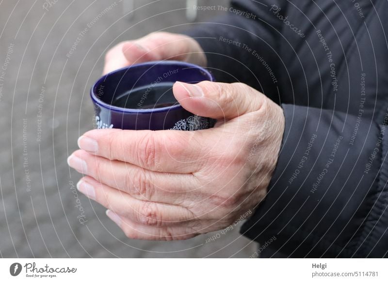 Hands holding a cup with hot punch Human being hands Detail Cup Punch Mulled wine To hold on warm sb./sth. Beverage Hot drink Christmas Fair Winter December