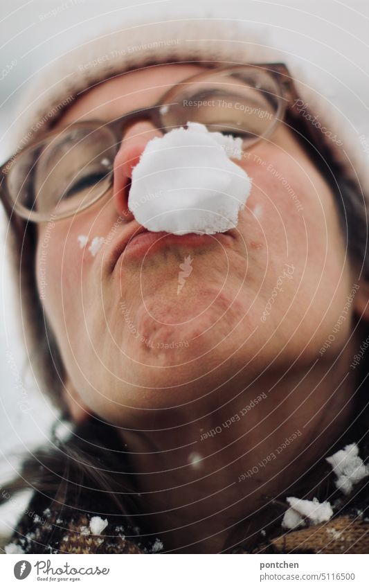 a snowball in the face of a woman. snowball fight Snowball Snowball fight Winter Face Strike Exterior shot Joy Happiness