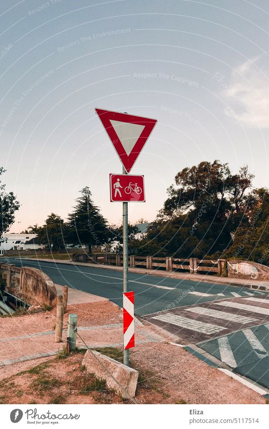 Give way Yield sign right of way sign Transport Pedestrian cyclists Road sign Signs and labeling Street Zebra crossing Road traffic Exterior shot