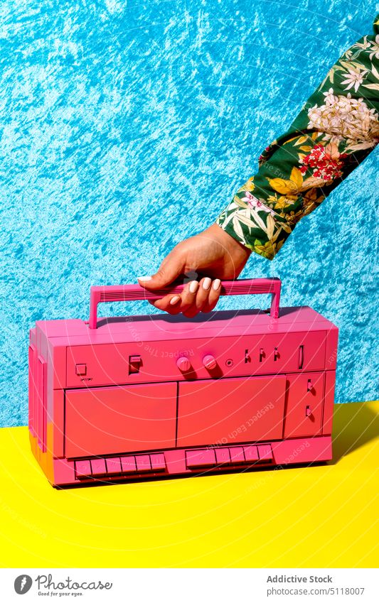 Crop anonymous lady with retro pink cassette recorder woman boombox music tape button old fashioned stereo song female young hand multimedia entertain vintage