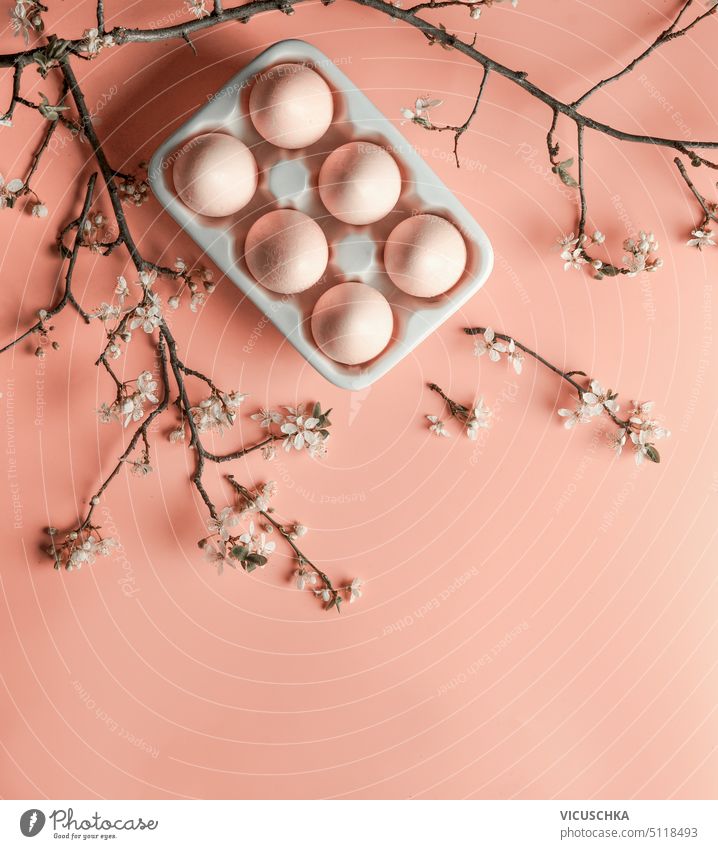 Easter background with Easter eggs and cherry blossom branches , top view easter easter eggs pink above springtime flower season celebration holiday