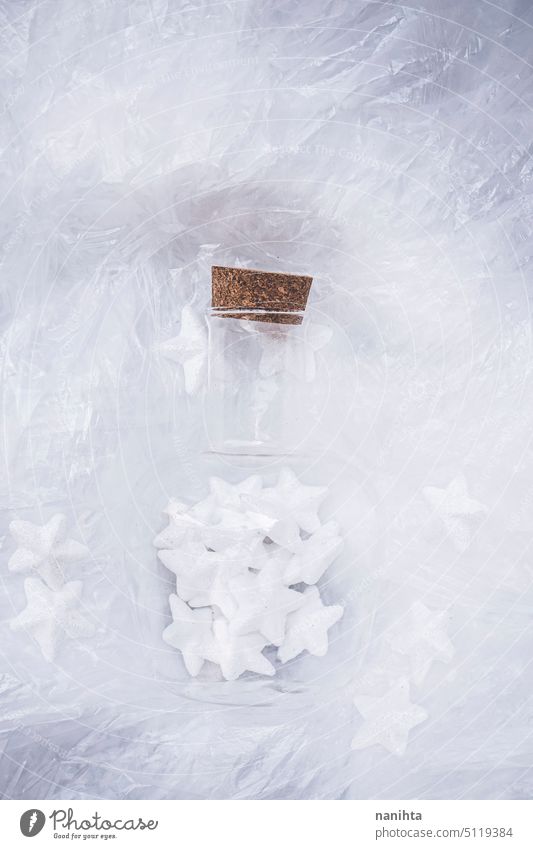 Magical image of christmas stars inside of a bottle against white background magic magical texture textured fragile potion plastic shine brilliant dreamy luck