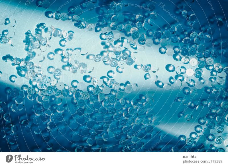 Texture image of many diamonds in blue water illuminated by sunlight as background elegant wealth texture pattern gems drops abundance eleagnce prosperity
