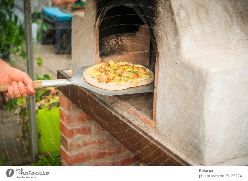 Homemade pizza on a shovel tomato gourmet forno image flyer margherita photography color log people outdoor material culture woodfire eating furnace cooked