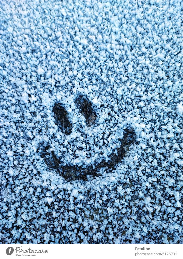 When I saw the frost on the stone slab, I just had to leave this smiley there. Cheeky he grins at everyone who walks by there. Frost chill Winter Cold Frozen