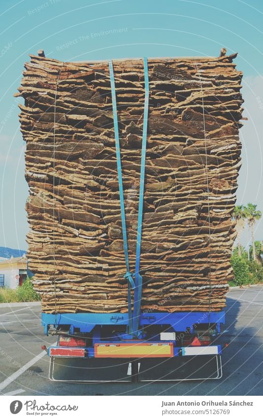 Truck loaded with cork truck trailer raw traditional industry Europe Spain Trailer transportation lorry cargo delivery road vehicle highway logistic traffic