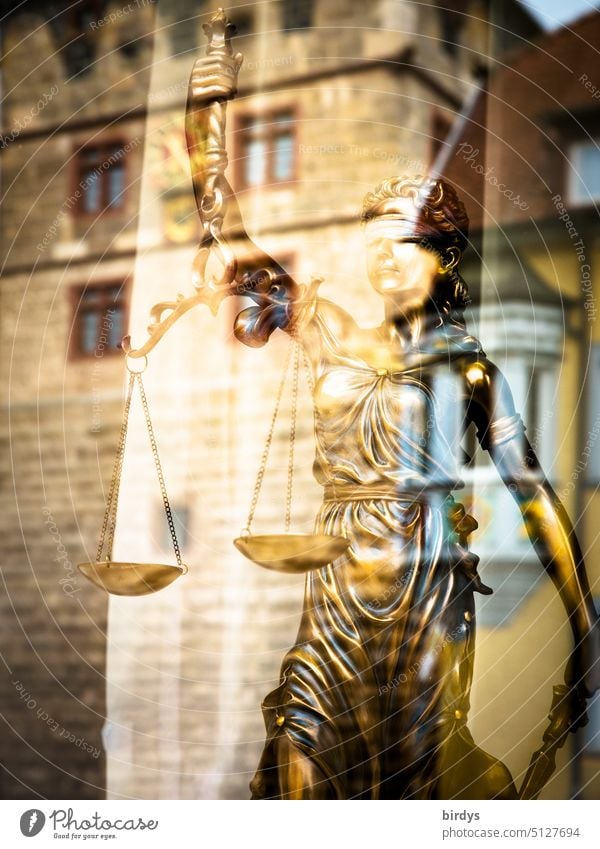 golden Justitia, goddess of justice behind a glass pane with reflection Lady Justice Fairness judiciary Balance tribunal felonies Scale Law