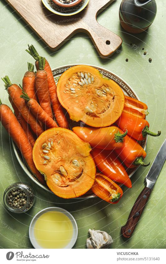 Group of healthy orange detox vegetables on table with ingredients, top view group overhead dieting pumpkin organic vitamin nutrition carrot vegetarian raw food