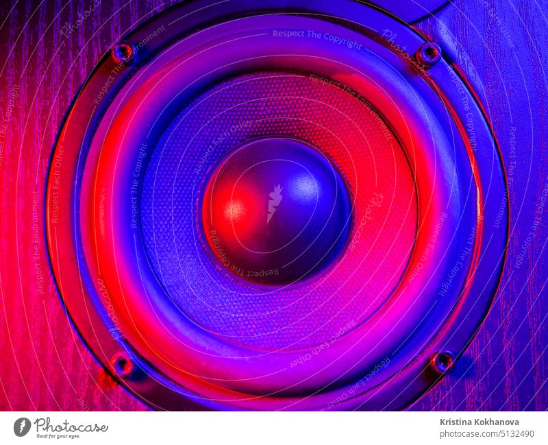 Close up details of loudspeaker woofer and tweeter driver. Colorful violet blue led light. music audio bass electronic equipment power sound studio technology