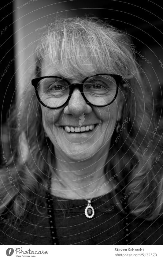 Looking to the future Black & white photo black-and-white portrait Eyeglasses Person wearing glasses laughing vivacious Woman middle age beauty ideal Aura