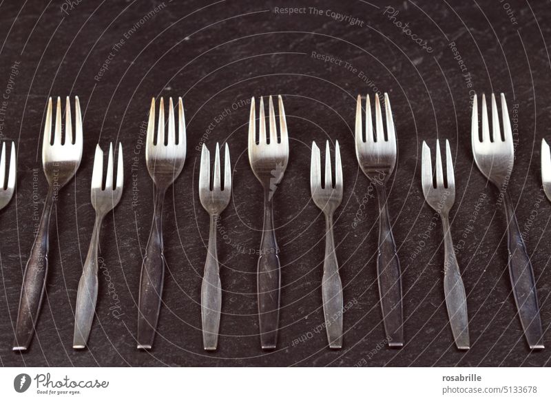 Forks - silverware on slate | color reduced forks Row Cutlery Old Ancient Slate Black Pastry fork Nutrition flat lay Pattern Abstract Gray silver plate