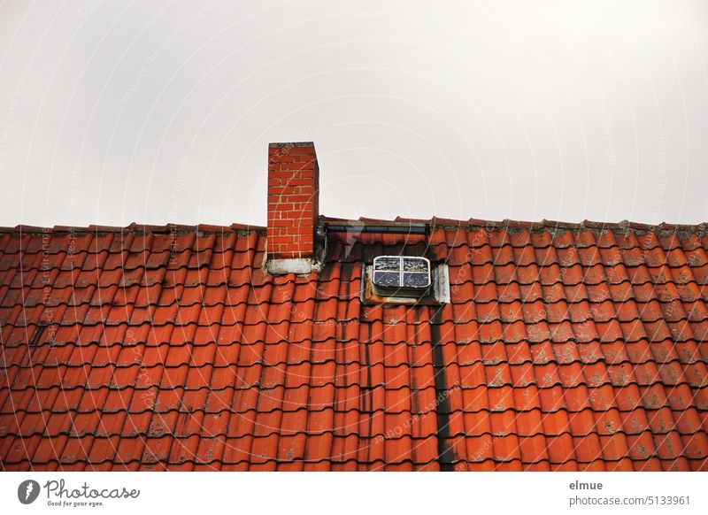 old red tiled roof with chimney and skylight / live Tiled roof Roofing tile house roof dwell Apartment Building Chimney Skylight Window Red Blog Architecture