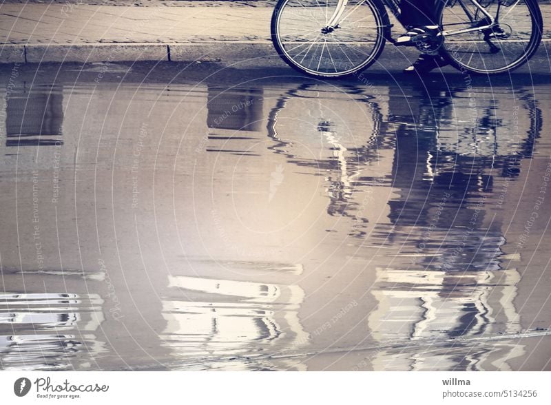 waterways Deluge Flood Street Bicycle reflection Puddle Wet Rain Inundated High tide Rainwater Water reflection Footpath Curbside cyclists