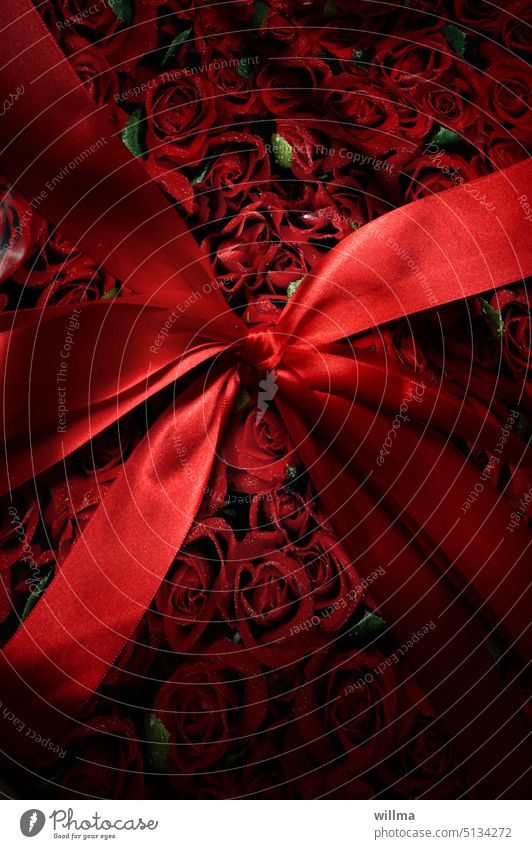 The gift - a red bow and wrapping paper with roses Gift Birthday gift Bow Red Gift wrapping Surprise Donate Feasts & Celebrations Joy