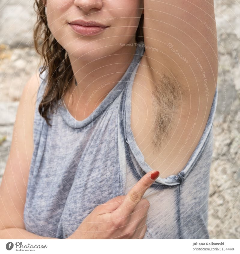 Woman proudly shows her armpit hair Normal Self-determination Self-confidence Activism Exterior shot Long-haired hygiene Underarm hair Hair and hairstyles