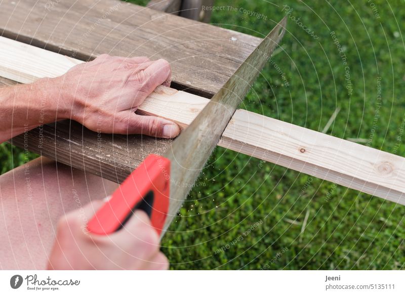 On the tilt | wooden slat is sawn Saw Craft (trade) Craftsperson Man Wood Tool Home improvement Build Wooden board Hand Profession Joiners workshop Carpenter