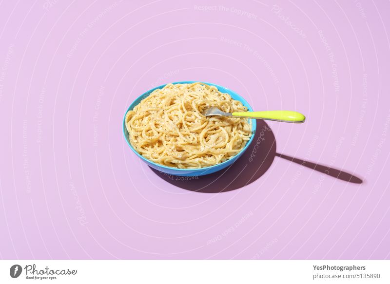 Spaghetti cacio e pepe bowl, isolated on a purple background bright carbs cheese color cooked copy space creative cuisine cut out delicious dinner dish eating