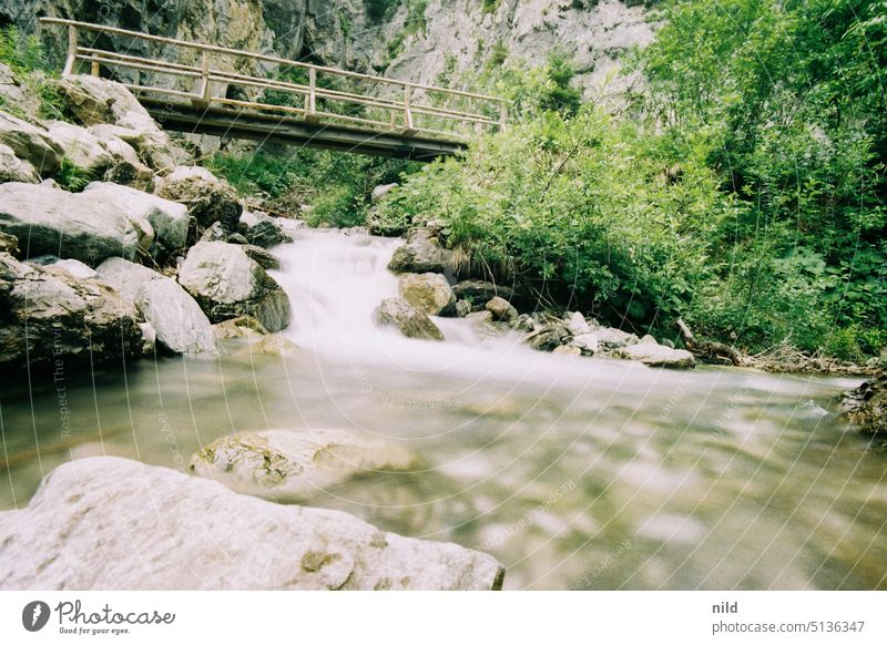 Mountain stream and small bridge, long time exposure mountain brook Nature Landscape Water Brook Flow Rock Deserted Canyon Exterior shot Environment Elements