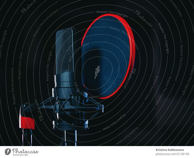 Microphone on black background in recording studio. Music, concert concept. audio dark equipment mic microphone music musical object performance silver sound
