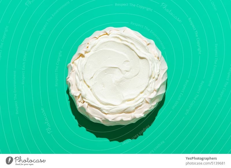 Pavlova cake in bright light, isolated on a green background above australian baked color comfort copy space cream crispy crust cuisine delicious design dessert
