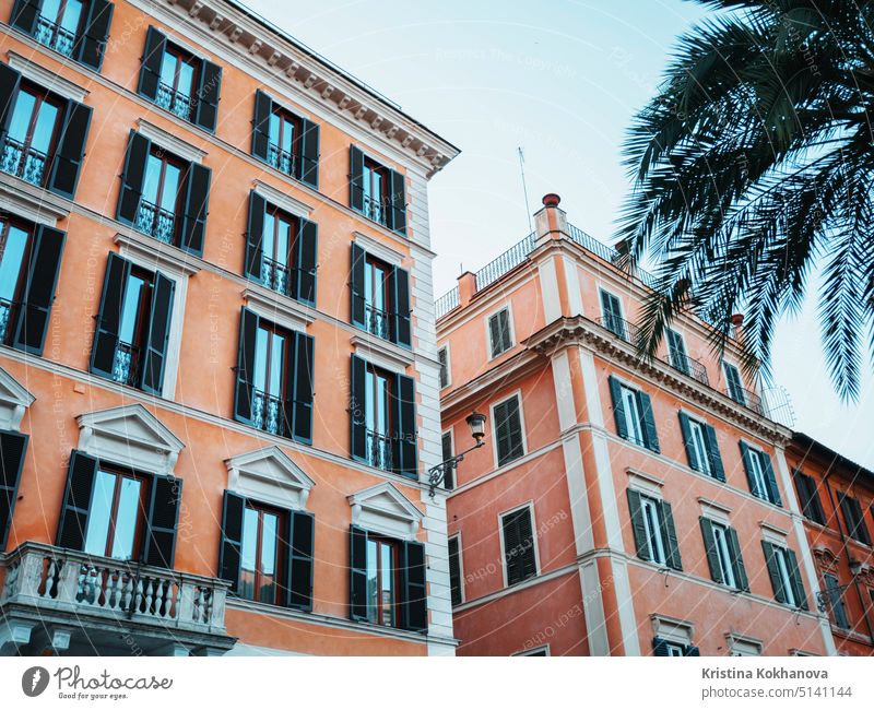 Beautiful facade of apartment building in Rome, Italy. Windows with shutters. wall home tourism architecture house city exterior italy old rome window urban