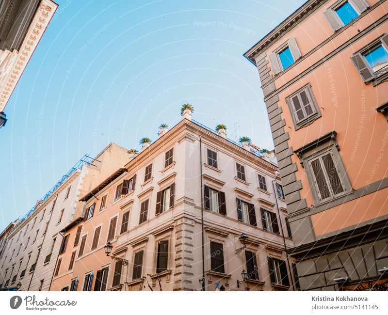 Beautiful facade of apartment building in Rome, Italy. Windows with shutters. wall home tourism architecture house city exterior italy old rome window urban
