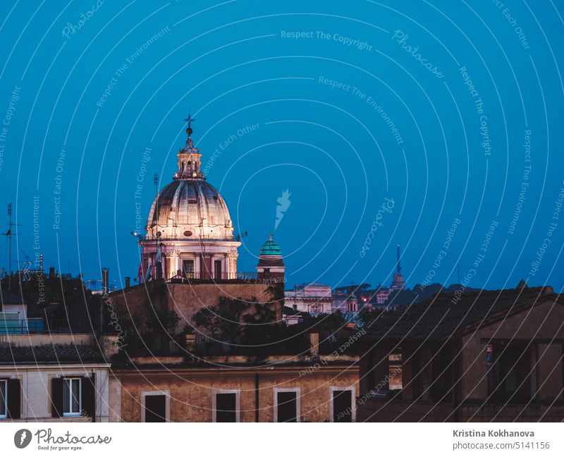 Beautiful night aerial view of Piazza Spagna - Rome, Italy. Dome of cathedral on blue sky background architecture city dome europe travel cityscape dusk