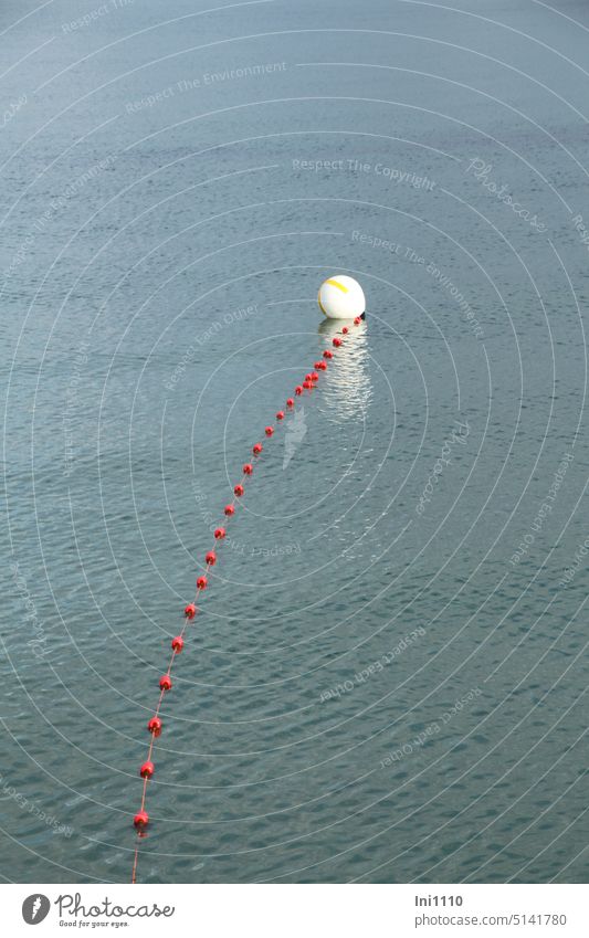 Floating line with red balls and bathing boundary buoy Ocean Baltic Sea Water Boundary buoy Bathing zone bathing area beachfront Safety cordon label Clue