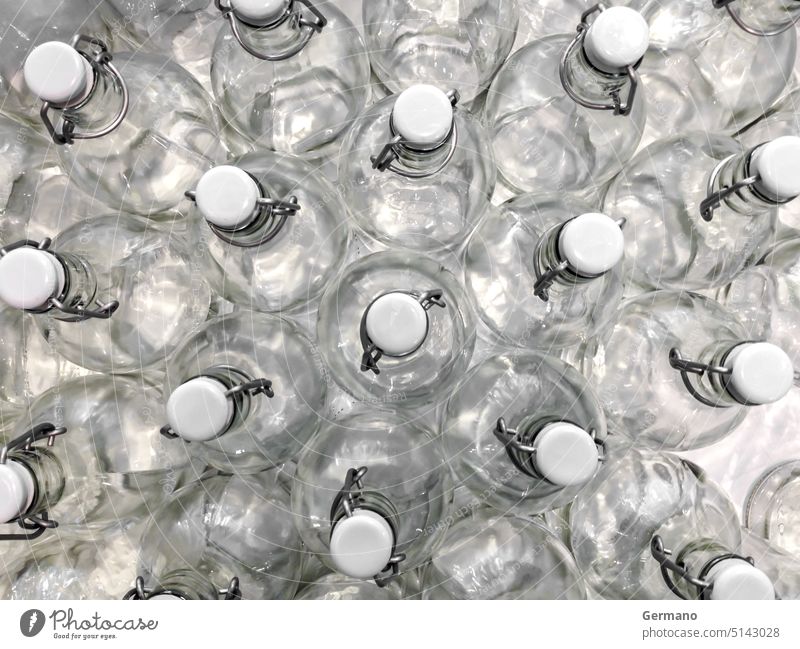 Transparent bottles seen from above background bright clean closed closeup color container cool drinks empty fresh freshness glass new object plug reflection
