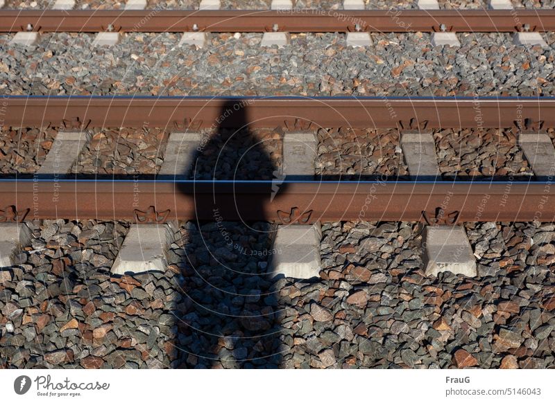 totally stupid |with his head on the rails... Railroad tracks Railroad system Rail transport Traffic infrastructure Track sleepers gravel Track bed Shadow