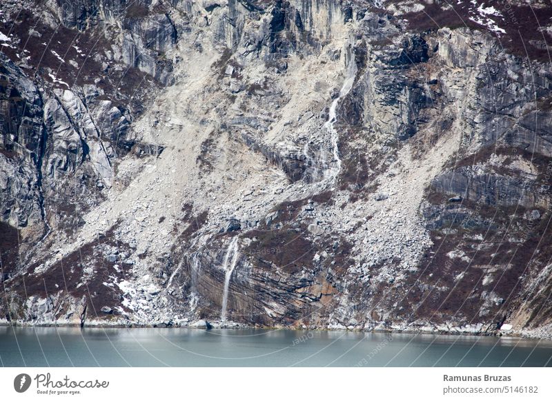 Glacier Bay National Park Steep Shore With A Waterfall view scenic abstract background nature water bay waterfall shore coast coastline rock stone outdoor