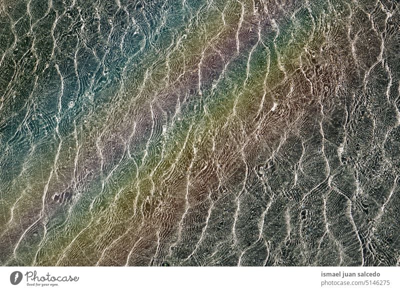 rainbow on the water reflection in the swimming pool textured abstract wave clear surface pattern liquid bright waves nature aqua summer turquoise wet