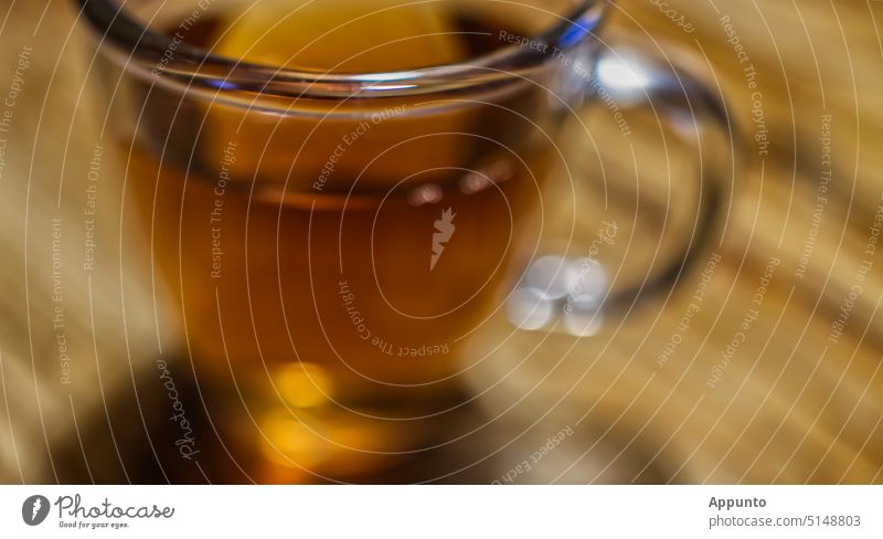 teatime in a hurry Tea Black tea Glass golden bokeh Beverage Haste blurriness Hot Darjeling tranquillity expeditious Stress leisure take time Time Drinking