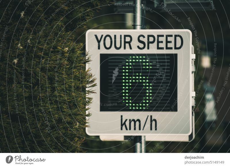 Patterned driving , displayed in green. Your Speed 6 km / h. Scoreboard Display Technology Digital Screen Equipment Electronic Communication Smart Green pole