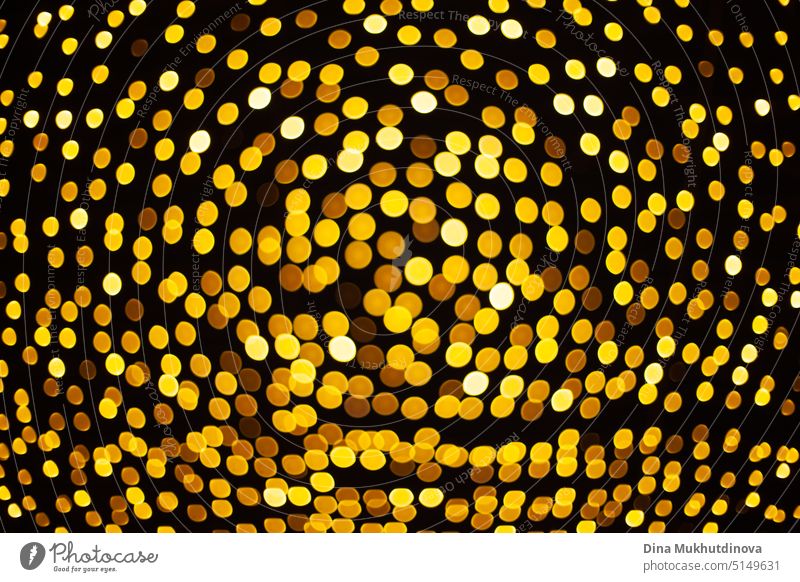 yellow bokeh bright lights pattern background at night, round shape golden lights as Christmas holidays festive backdrop shine christmas new year eve celebrate